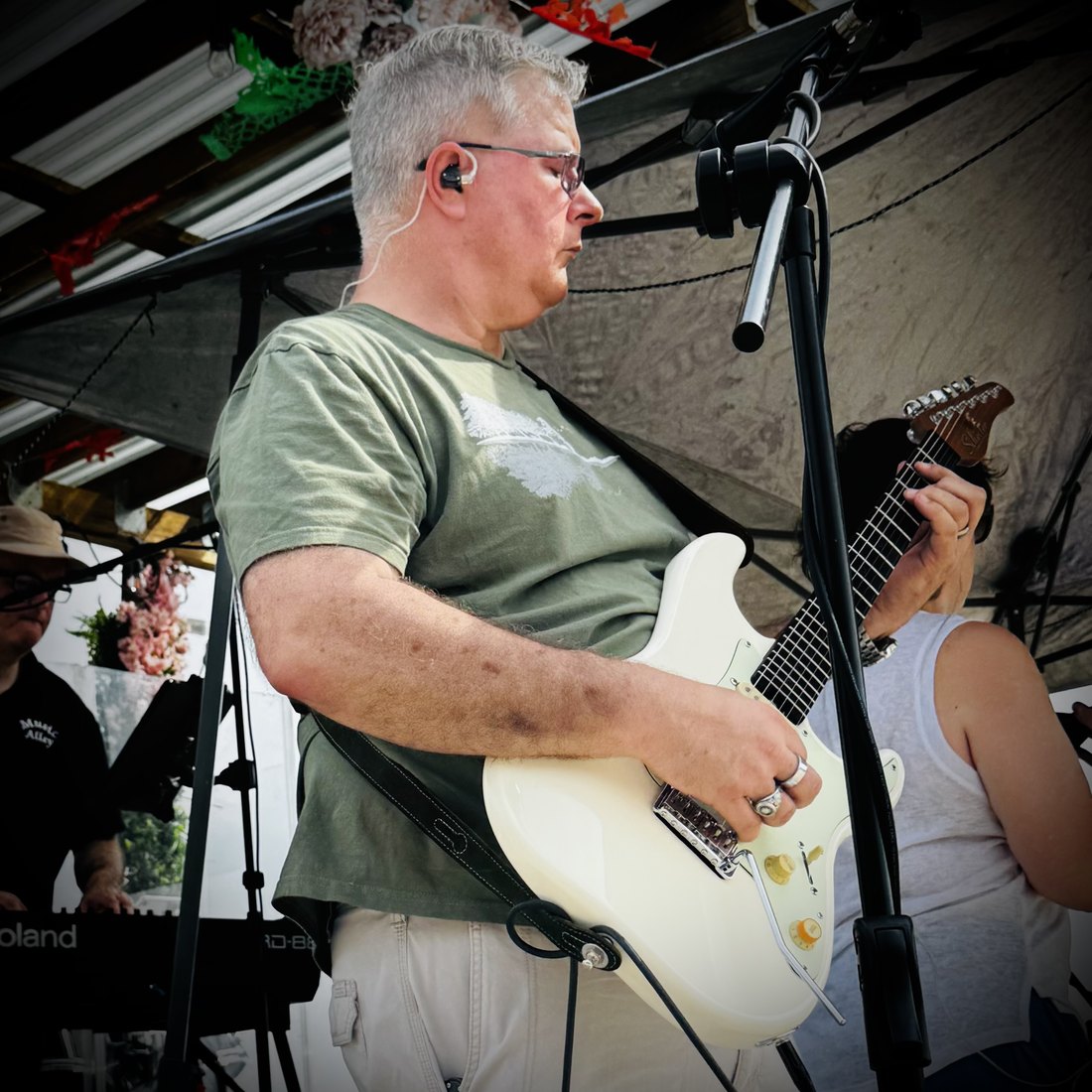 Andy playing guitar with Music Alley